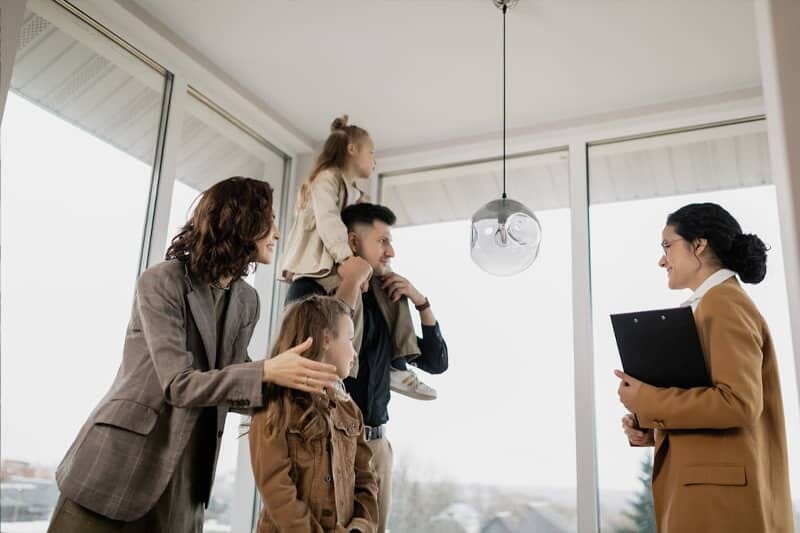 Agent showing curated luxury property listings to client